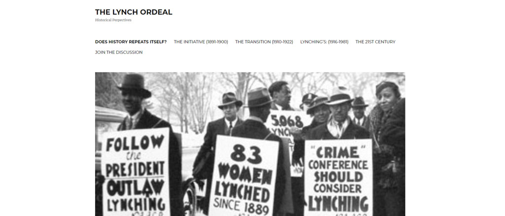 Man in hats holding banners